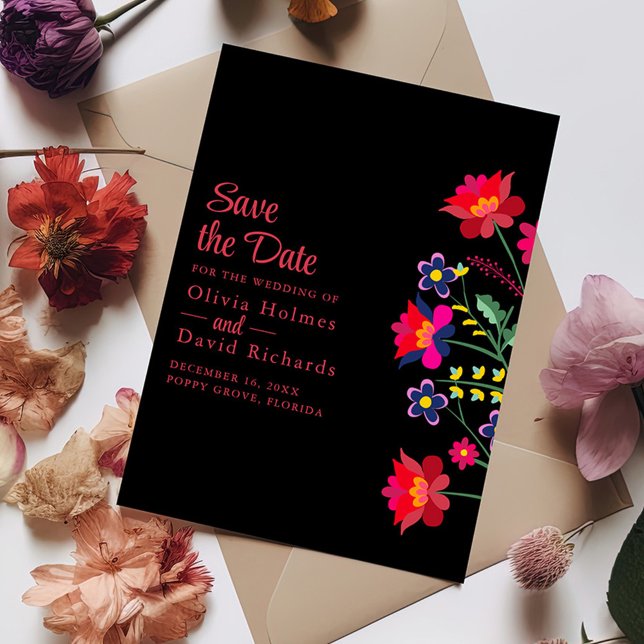 Svart mexikansk Blommigt Fiesta Spara datumkortet Inbjudningar (Black Mexican Floral Fiesta Save the Date Card on a table with colorful flowers.)