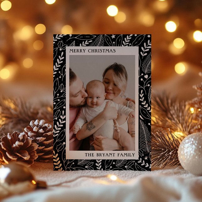 Svart modern ram med konstverk föreställande järne julkort (Skapare uppladdad)