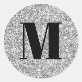 Svart monogram på falskt silverglitter runt klistermärke