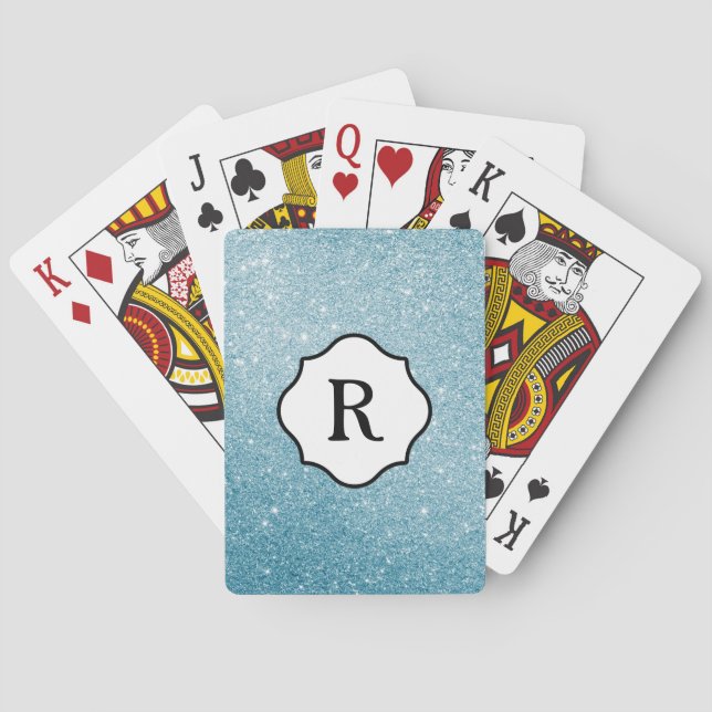 Svart monogram på glittrande akvamarinfärg casinokort (Baksidan)