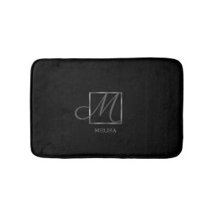 Svart monogramdesign för elegant badrumsmatta