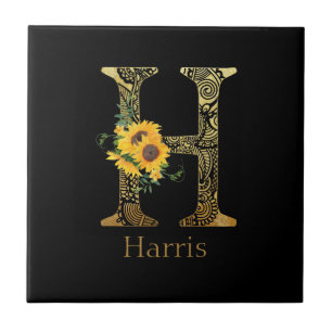 Svart och Guld Brev H Solblommor Kakelplatta