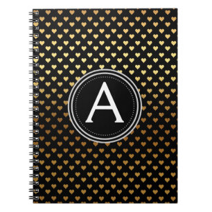 Svart och guldfärgad monogram bärbar dator med hjä anteckningsbok