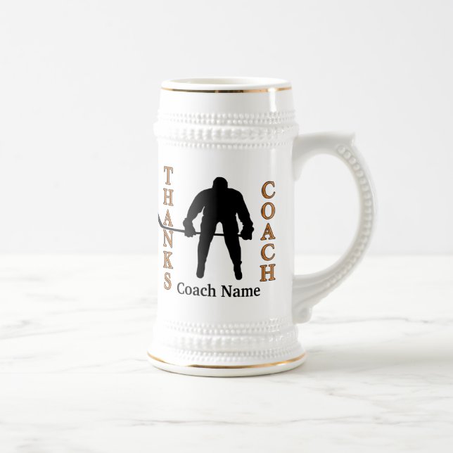 Svart och Orange Hockey Coach ger PHOTO och TEXT Sejdel (Höger)