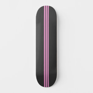 Svart och rosa randig skateboard