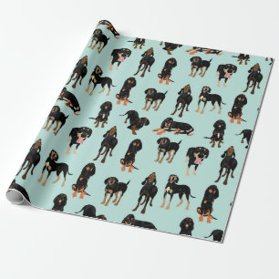Svart och solbränd Coonhound som slår in papper Presentpapper