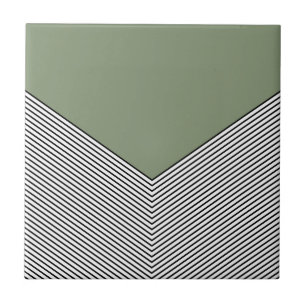 Svart och vit chevron-design och triangel för grön kakelplatta