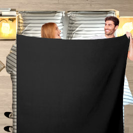 Svart och vit fast beslag av färg fleecefilt