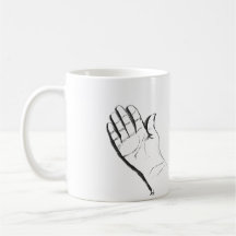 svart och vit hand på kaffemugg