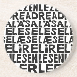 Svart och vit "Läs" på 8 språk Lino-klipp Underlägg