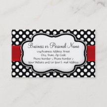 Svart och vit prickig med röd slinga