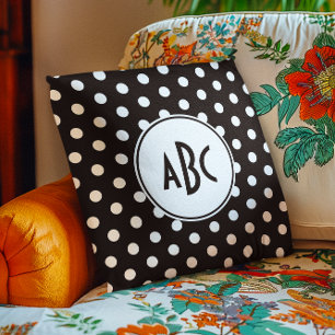Svart och vit prickig monogram kudde