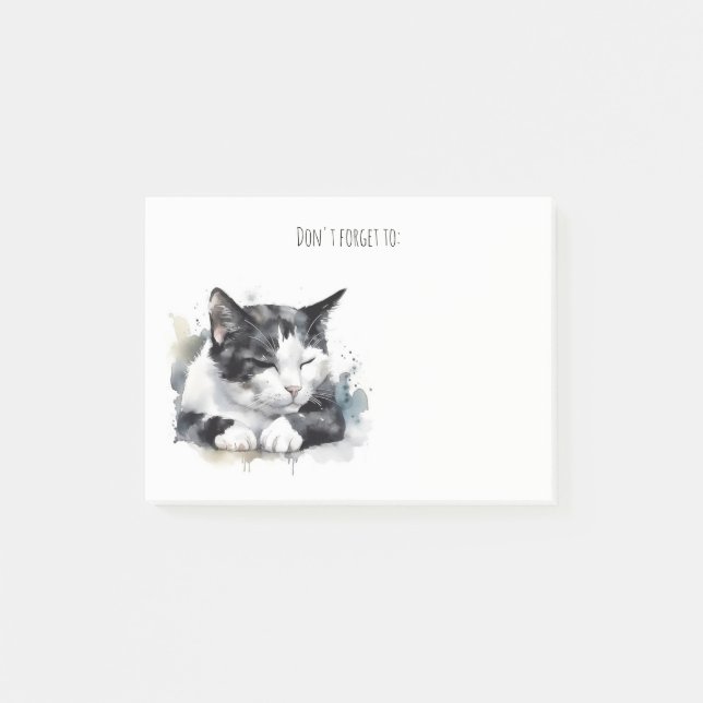 Svart och vit tuxedo-katt som bokför anteckningar post-it block (Framsida)