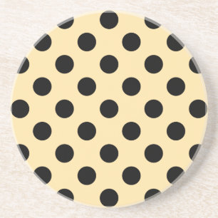 Svart polka dots på blekens gult underlägg