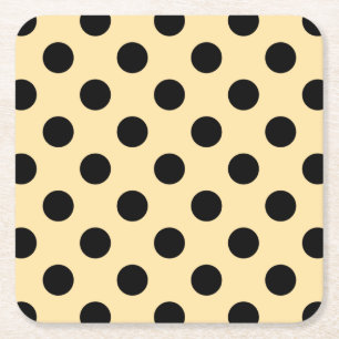Svart polka dots på blekens gult underlägg papper kvadrat