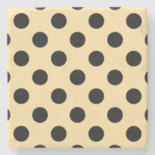 Svart polka dots på blekens gult underlägg sten