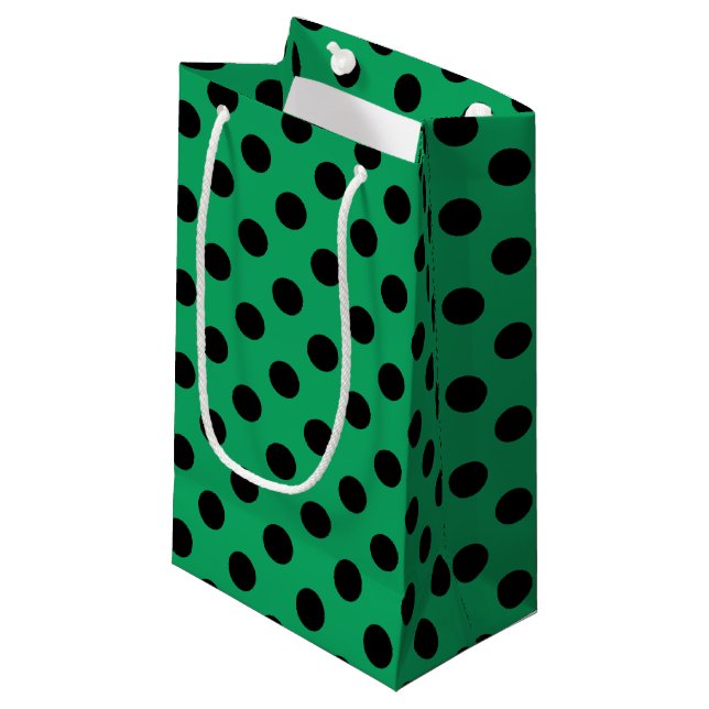 Svart polka dots på färsk grönt (Framsidan Vinklad)