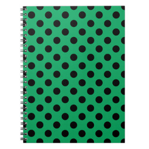 Svart polka dots på färsk grönt anteckningsbok