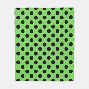 Svart polka dots på kalkgrönt fleecefilt