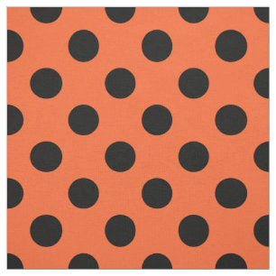 Svart polka dots på orange tyg
