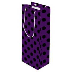 Svart polka dots på plommonets lila