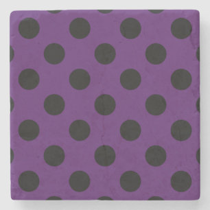 Svart polka dots på plommonets lila underlägg sten