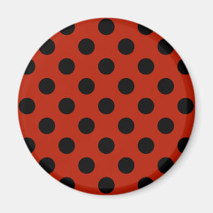Svart polka dots på rött magnet