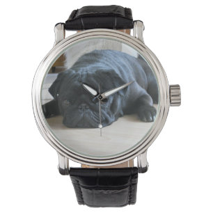 Svart puckelplatta armbandsur