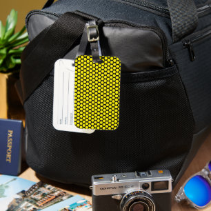 Svart resväskemärke med gul prick-design bagagebricka