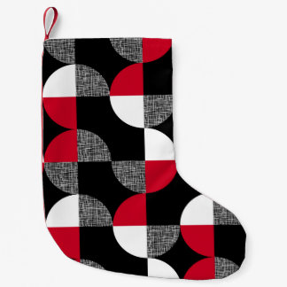 Svart, röd, vit geometrisk plaid mönster. liten julstrumpa