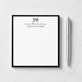 svart rosett, från skrivbordet notepad anteckningsblock
