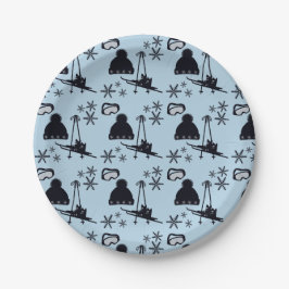 Svart skidutrustning och snöflingor på blå skidutr