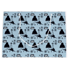 Svart skidutrustning och snöflingor på blå skidutr