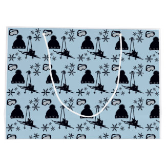 Svart skidutrustning och snöflingor på blå skidutr