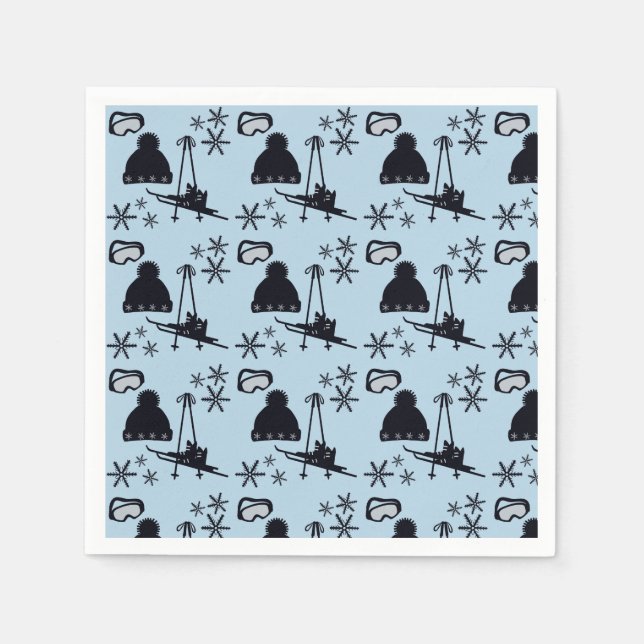 Svart skidutrustning och snöflingor på blå skidutr pappersservett (Framsidan)