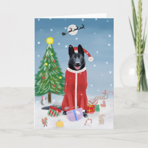 Svart tysk schäferhund i snö julklappar kort