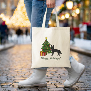 Svart tysk schäferhund och grön julgran tygkasse