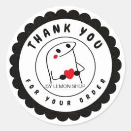 Svart, underlig teckencirkel runt klistermärke