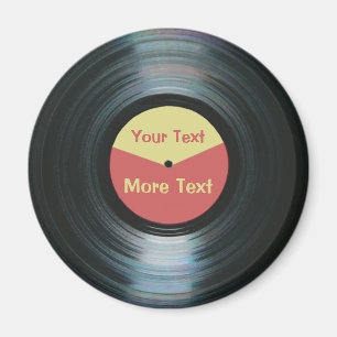 Svart vinylmusik med den röda och gula rekord- magnet
