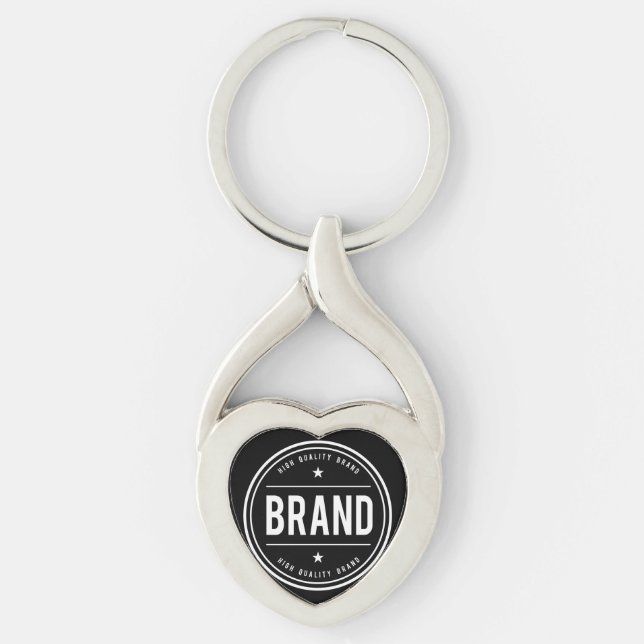 Svart-vit cirkulär badge-logotyp twisted heart silverfärgad nyckelring (Framsidan)