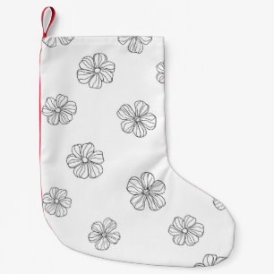 Svarta blommor från hand plockade på vit bakgrund. liten julstrumpa