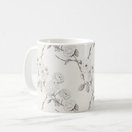 Svarta höstblommor i kräm kaffemugg