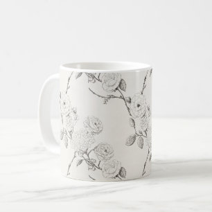 Svarta höstblommor i kräm kaffemugg