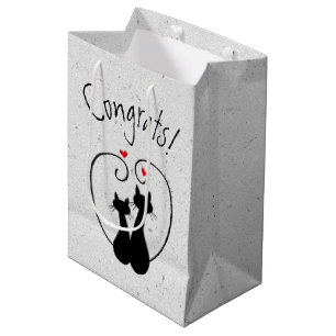 Svarta katter med röda hörn