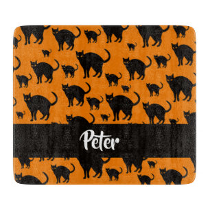Svarta katter på orange