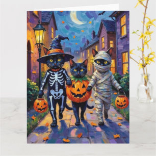 Svarta katter som söker godis på Halloween Kort