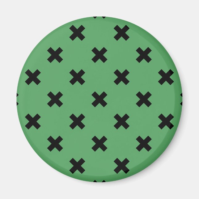 Svarta kor sytlar på grönt magnet (Framsidan)