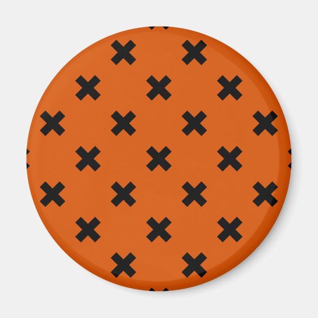 Svarta kor sytlar på orange magnet (Framsidan)