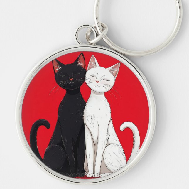 Svarta och vita katter rund silverfärgad nyckelring (Framsidan)