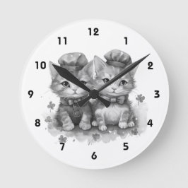 Svarta och vita kattungar med bockslips och söta h rund klocka